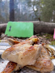 Chicken wings are fried outdoors in the forest