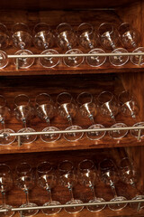 Wine glasses on a shelf in a wine cellar