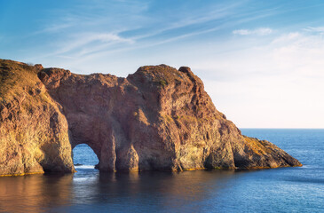 Fototapeta na wymiar Beautiful grotto on the sea during the sunse