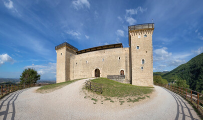 Fototapeta na wymiar Spoleto, Italy. Entrance to Rocca di Spoleto (Rocca Albornoziana) - medieval fortress located on the top of the Sant'Elia hill