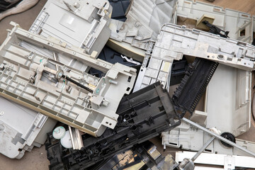 Plastic housings and parts of the disassembled printer. Computer junk.