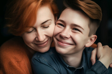 A tender moment between a smiling redheaded mother and son at home, showing a warm, loving family.