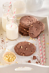 Delicious and sweet chocolate cookies served with milk in bottle.