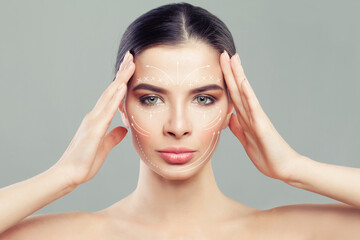 Naklejka premium Cute woman. Face lift anti-aging lines on young female face. Graphic lines showing facial lifting effect on skin. Plastic surgery, cosmetology and massage concept