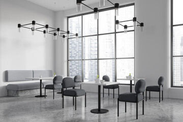 Modern restaurant interior with chairs and tables in row, panoramic window