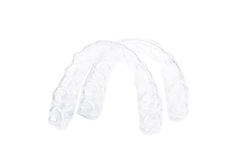 Invisible aligners for whitening and straightening of teeth close up on white background. Orthodontic therapy after brackets. Teeth healthcare
