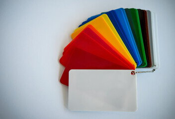 Colored acrylic plates for choosing the color of the material. Search for the right shade for repairs.A multicolored plastic fan.