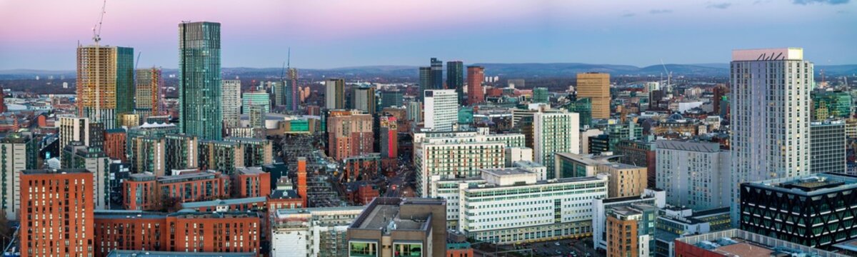 Aerial image of Manchester cityscape at dusk showing new urban developments