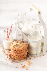 Tasty sunflower seed cookies served with milk in bottle.