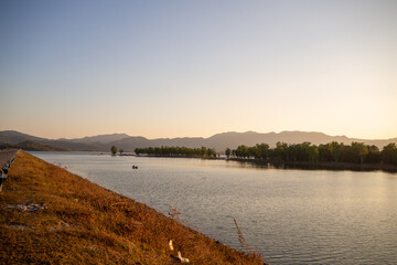 River and Lake Sunset and Sunrise with Beautiful Sky and Water Reflection at Mea Mok, Lampang,...