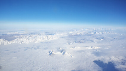 Fototapeta na wymiar Mountain range and white clouds in blue sky at day