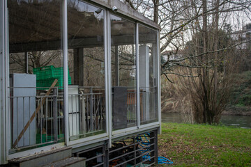 window in the woods, old build, river on park