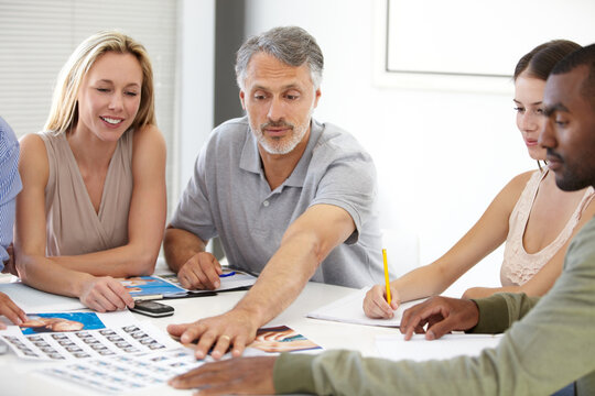 Creative, meeting and team planning with magazine, photoshoot and review of photography editing process. Office, people and talking about print, results and decision for production of paper catalog