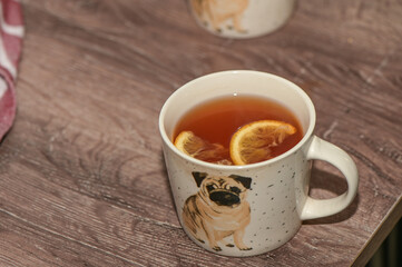 tea with lemon in a cup with a drawn pug 3