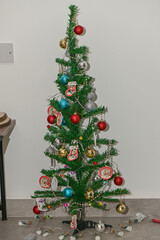 Christmas tree decorated with toys on a white background 2