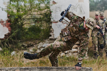 A highly trained elite military unit, clad in camouflage, skillfully navigates through perilous...