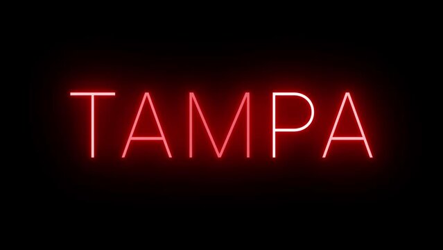 Flickering red retro style neon sign glowing against a black background for TAMPA