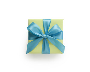Top view of green gift box with blue ribbon bow isolated on white background