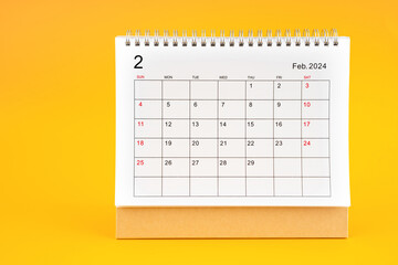 February 2024, Monthly desk calendar for 2024 year on yellow background.