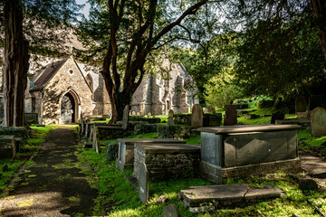 Fototapeta na wymiar St Martin's Church And Graveyard With The Grave Of Poet Dylan Thomas in Laugharne, Wales, United Kingdom