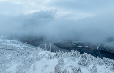 Power line in mountain, high voltage line over the mountain.