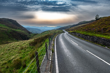 Abandoned Road Through Spectacular Rural Landscape Of Snowdonia National Park In North Wales,...