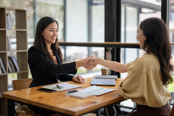 Businesswoman shaking hands during a meeting success, dealing, greeting and partner concept.