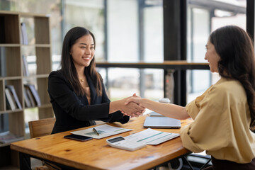 Businesswoman shaking hands during a meeting success, dealing, greeting and partner concept.