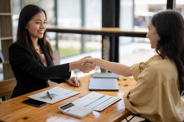 Businesswoman shaking hands during a meeting success, dealing, greeting and partner concept.