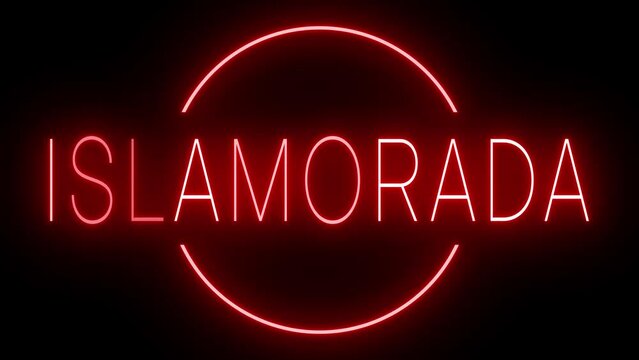 Flickering red retro style neon sign glowing against a black background for ISLAMORADA