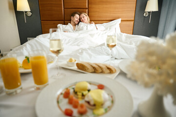 Couple relaxes in the honeymoon suite