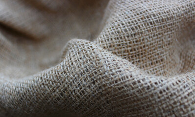 Handicraft Open Weave Burlap Folds Closeup View. Rough Crumpled Burlap Background
