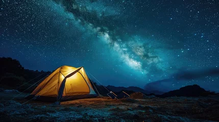 Poster Illuminated tent under glowing night sky with stars and milky way. Tourist equipment for camping. © Lubos Chlubny