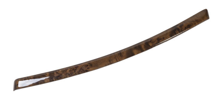 Decorative overlay of the panel and doors of the car interior from the root of the walnut tree in brown color.