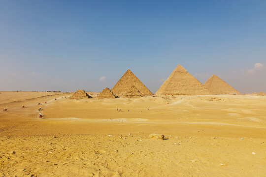 Egypt. Cairo - Giza. General view of pyramids from the Giza Plateau (on front side 3 pyramids popularly known as Queens' Pyramids; next: the Pyramid of Mykerinos, Chephren and Cheops)