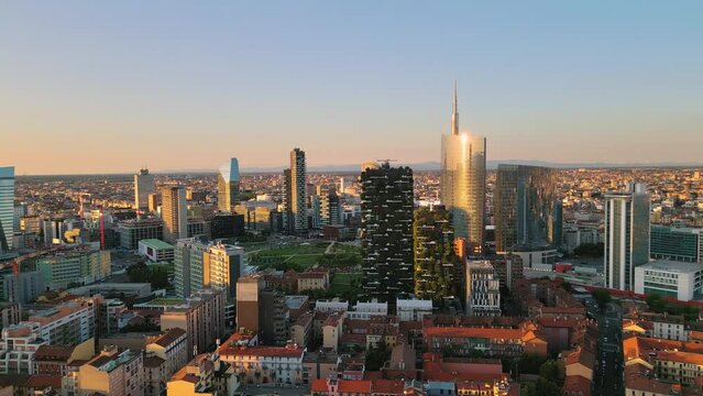 milan city porta nuova district aerial view drone pan at sunrise,urban cityscape skyline panoramic shot