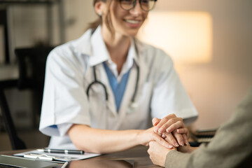 Female doctor sitting at work looking at the history of patients in the clinic or in the hospital