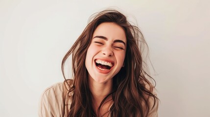 Young brunette woman over isolated white background laughing