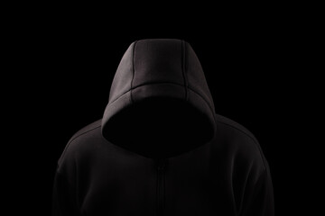 Man in Hood silhouette. Boy in a hooded sweatshirt on black
