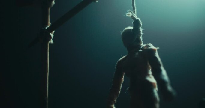 Miniature of the mummified doll hanging on the gallows at the evil altar