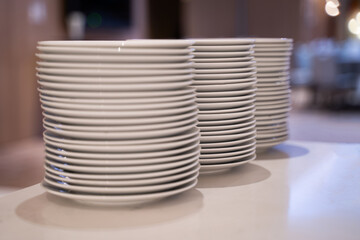 Many white dishes were placed on the table. In a coffee shop or restaurant