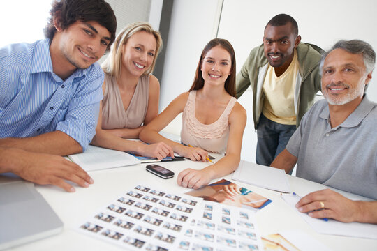 Design, meeting and portrait of people with magazine, photoshoot and review of photography editing process. Office, table and team happy with print, results or creative staff in production of catalog - Powered by Adobe