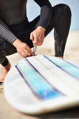 Surfing, beach and hands of person with surfboard for water sports, training and fitness outdoors. Nature, sand and closeup of surfer with equipment for adventure on holiday, vacation or hobby by sea