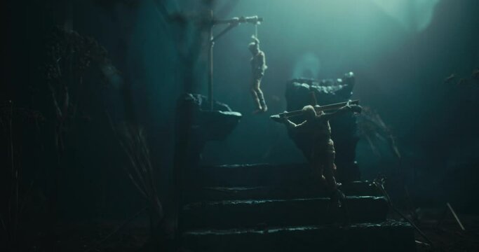 An evil altar at night with two dead bodies hanging on the gallows