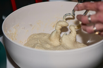 woman kneading dough with a mixer in the kitchen 5