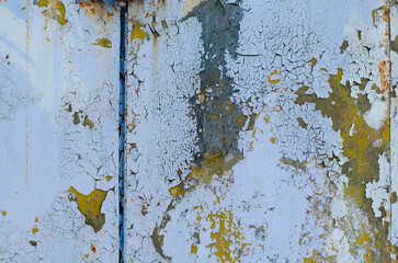 Old rusty surface. Cracked paint. Vintage painted surface. Steel rivets.