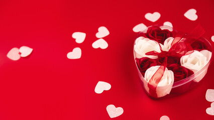 Valentine's Day concept.Valentine's Day background. Gifts, confetti, card on a red background. Flat lay. Valentine's day celebration. place for text.