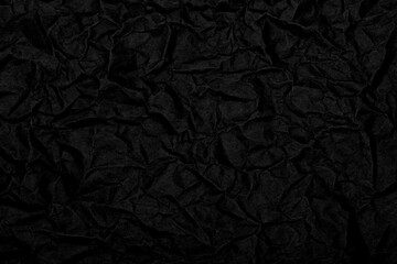 Black wrinkled paper texture background