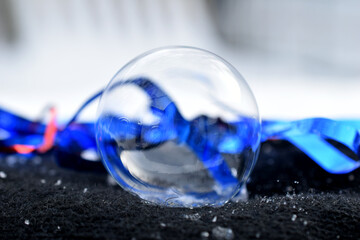 Soap bubble in the form of a transparent ball.