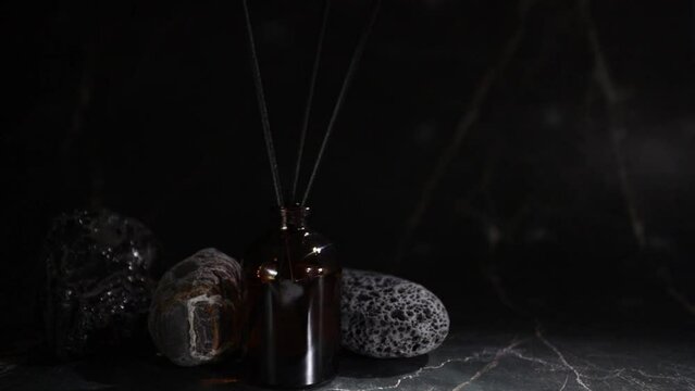 Aroma diffuser with natural stones, tranquil spa atmosphere, essential oil diffusion, calming ritual